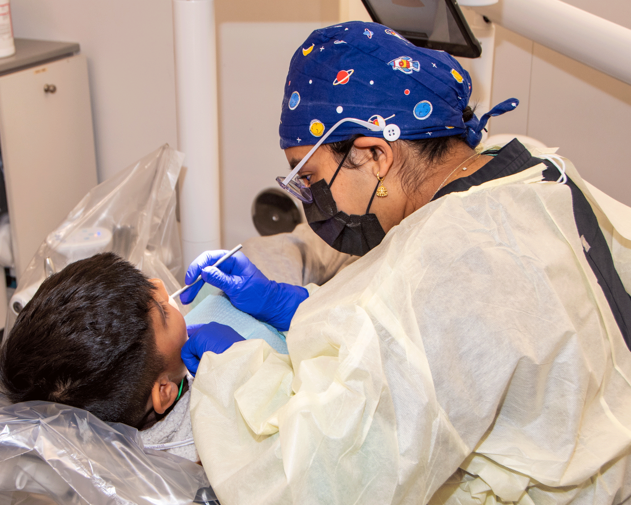 Child receives dental care from an IUSD student